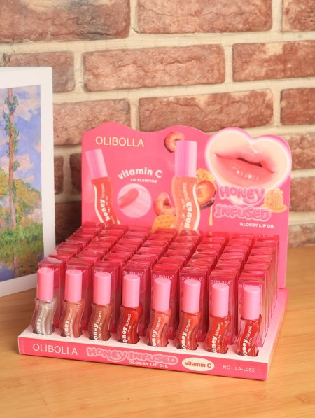 ستاند GLOOSY LIP OIL من OLIBOLLA.